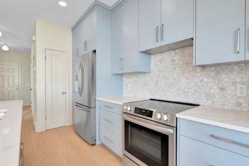 96 Fireside Common, Cochrane, AB - Indoor Photo Showing Kitchen With Upgraded Kitchen