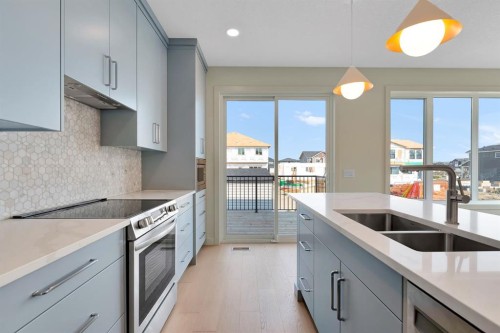 96 Fireside Common, Cochrane, AB - Indoor Photo Showing Kitchen With Double Sink With Upgraded Kitchen