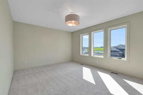 96 Fireside Common, Cochrane, AB - Indoor Photo Showing Other Room