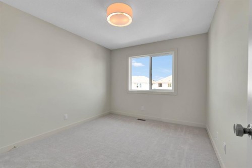 96 Fireside Common, Cochrane, AB - Indoor Photo Showing Other Room
