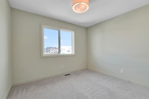 96 Fireside Common, Cochrane, AB - Indoor Photo Showing Other Room