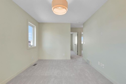 96 Fireside Common, Cochrane, AB - Indoor Photo Showing Other Room