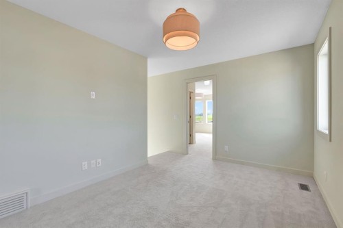 96 Fireside Common, Cochrane, AB - Indoor Photo Showing Other Room
