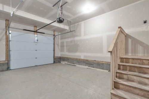 96 Fireside Common, Cochrane, AB - Indoor Photo Showing Garage