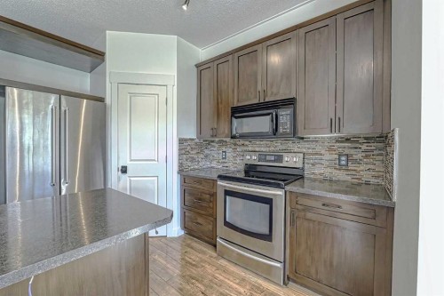 179 Rainbow Falls Drive, Chestermere, AB - Indoor Photo Showing Kitchen