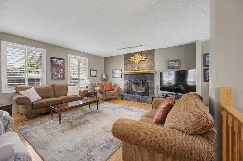 7 Straddock Crescent Sw, Calgary, AB - Indoor Photo Showing Living Room With Fireplace