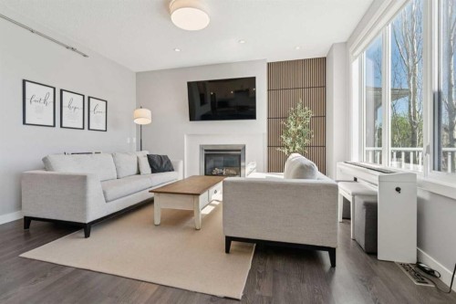 52 Mahogany Way Se, Calgary, AB - Indoor Photo Showing Living Room With Fireplace
