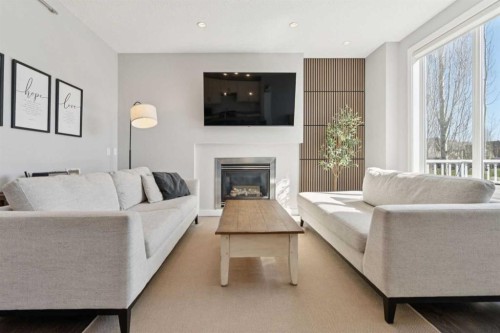 52 Mahogany Way Se, Calgary, AB - Indoor Photo Showing Living Room With Fireplace