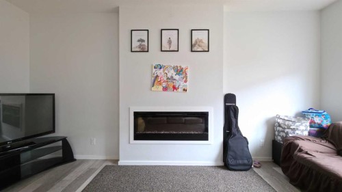 113 Cityspring Manor Ne, Calgary, AB - Indoor Photo Showing Living Room With Fireplace