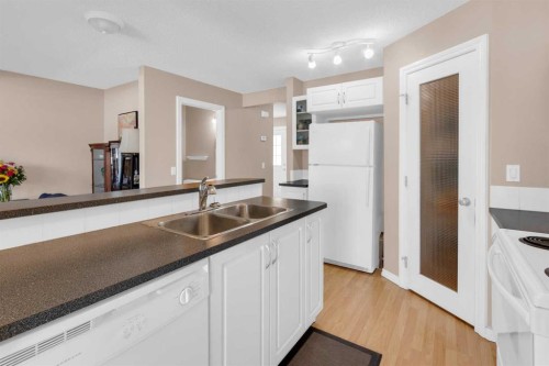 27 Royal Birch Mount Nw, Calgary, AB - Indoor Photo Showing Kitchen With Double Sink