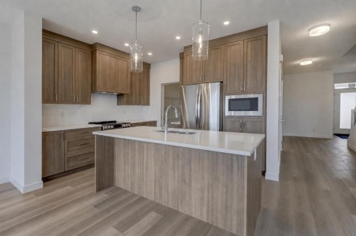 1333 South Point Parade Sw, Airdrie, AB - Indoor Photo Showing Kitchen With Double Sink With Upgraded Kitchen