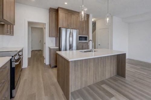 1333 South Point Parade Sw, Airdrie, AB - Indoor Photo Showing Kitchen With Double Sink With Upgraded Kitchen