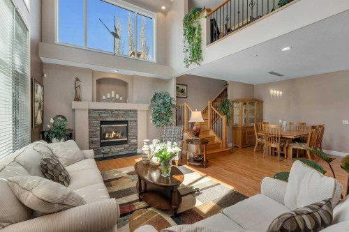 101 Valley Creek Place Nw, Calgary, AB - Indoor Photo Showing Living Room With Fireplace