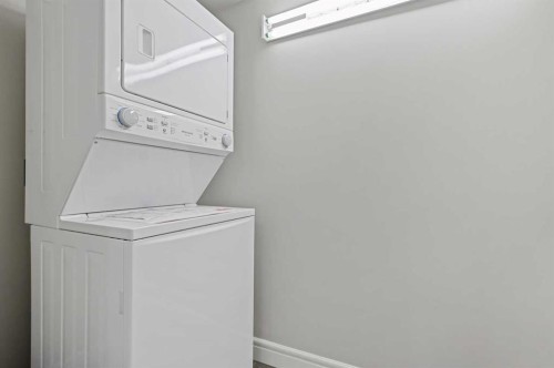 1607-910 5 Avenue Sw, Calgary, AB - Indoor Photo Showing Laundry Room