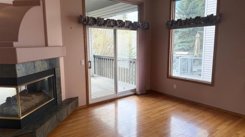 117 Woodpark Close Sw, Calgary, AB - Indoor With Fireplace