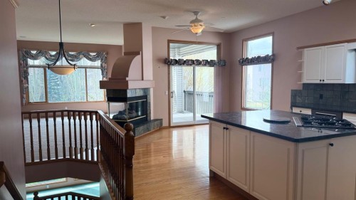 117 Woodpark Close Sw, Calgary, AB - Indoor With Fireplace