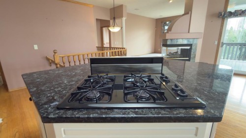 117 Woodpark Close Sw, Calgary, AB - Indoor With Fireplace