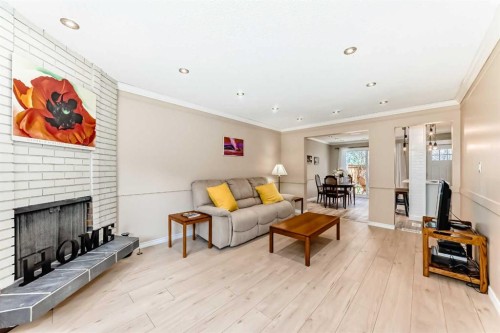 8-714 Willow Park Drive Se, Calgary, AB - Indoor Photo Showing Living Room With Fireplace