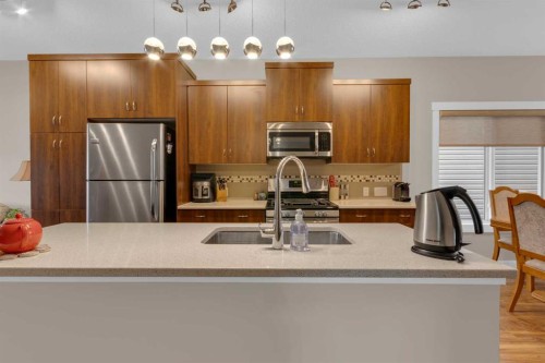 129 Fireside Place, Cochrane, AB - Indoor Photo Showing Kitchen With Double Sink With Upgraded Kitchen