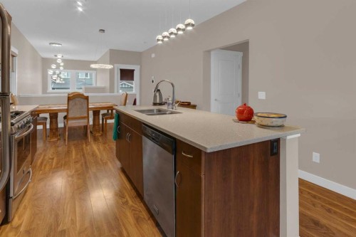 129 Fireside Place, Cochrane, AB - Indoor Photo Showing Kitchen With Double Sink