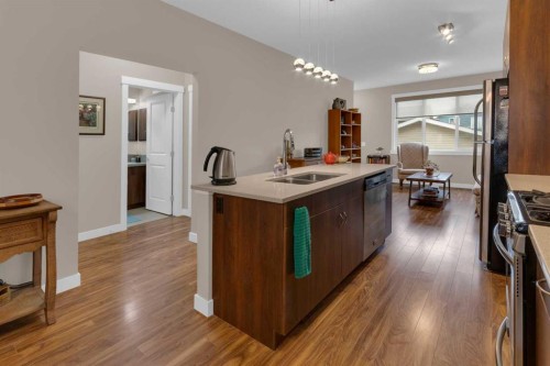 129 Fireside Place, Cochrane, AB - Indoor Photo Showing Kitchen With Double Sink