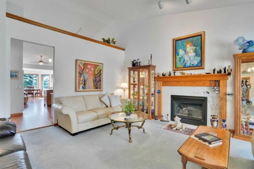 82 Valley Ridge Point Nw, Calgary, AB - Indoor Photo Showing Living Room With Fireplace