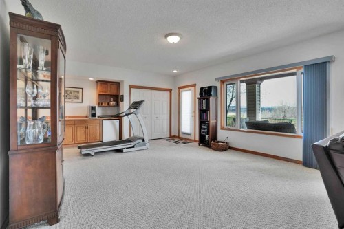 82 Valley Ridge Point Nw, Calgary, AB - Indoor Photo Showing Gym Room