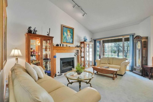 82 Valley Ridge Point Nw, Calgary, AB - Indoor Photo Showing Living Room With Fireplace