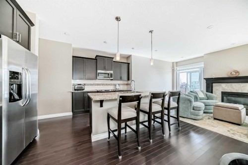 46 Nolanfield Road Nw, Calgary, AB - Indoor Photo Showing Kitchen With Fireplace With Stainless Steel Kitchen With Upgraded Kitchen