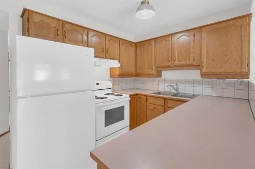 216 Shawinigan Drive Sw, Calgary, AB - Indoor Photo Showing Kitchen With Double Sink