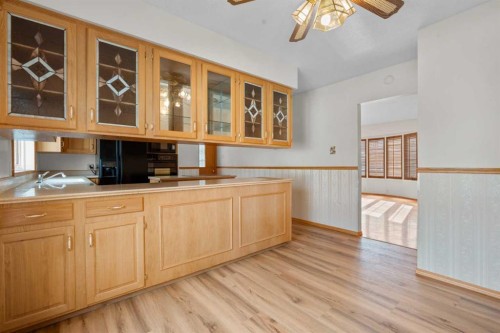 444 Woodland Crescent Se, Calgary, AB - Indoor Photo Showing Kitchen With Double Sink
