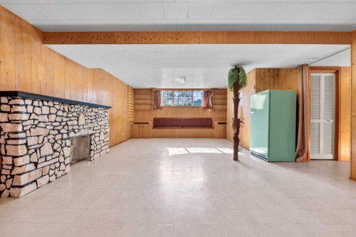 444 Woodland Crescent Se, Calgary, AB - Indoor Photo Showing Other Room With Fireplace