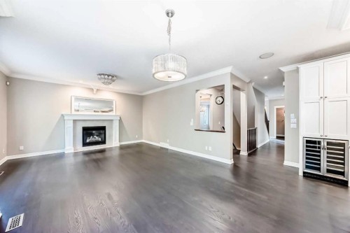 173 Aspenshire Drive Sw, Calgary, AB - Indoor Photo Showing Living Room With Fireplace