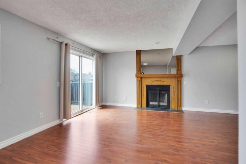 336 Whitworth Way Ne, Calgary, AB - Indoor Photo Showing Living Room With Fireplace