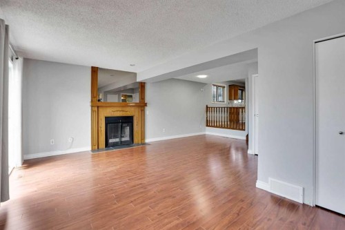 336 Whitworth Way Ne, Calgary, AB - Indoor Photo Showing Living Room With Fireplace