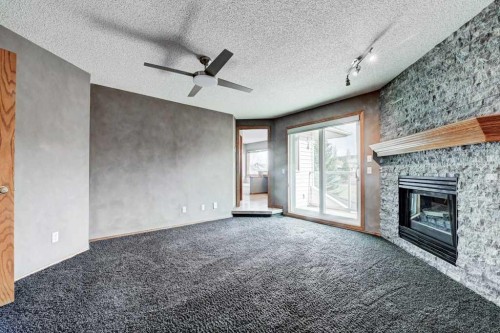 91 Valley Ridge Green Nw, Calgary, AB - Indoor With Fireplace