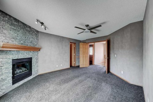 91 Valley Ridge Green Nw, Calgary, AB - Indoor With Fireplace