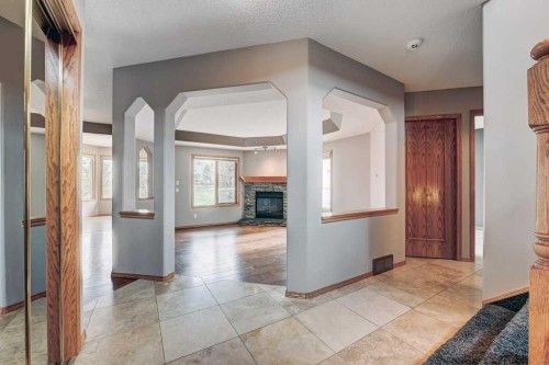 91 Valley Ridge Green Nw, Calgary, AB - Indoor Photo Showing Other Room With Fireplace