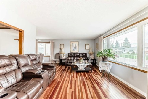 247 Huntford Way Ne, Calgary, AB - Indoor Photo Showing Living Room