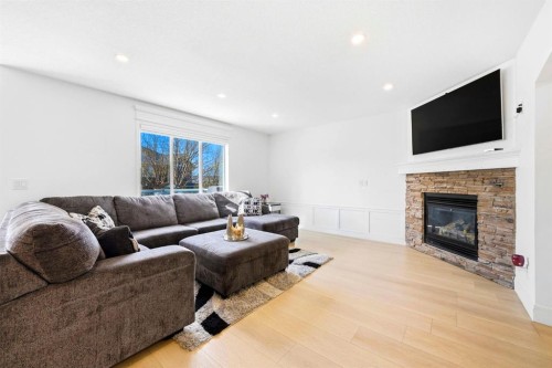 193 Hidden Creek Road Nw, Calgary, AB - Indoor Photo Showing Living Room With Fireplace