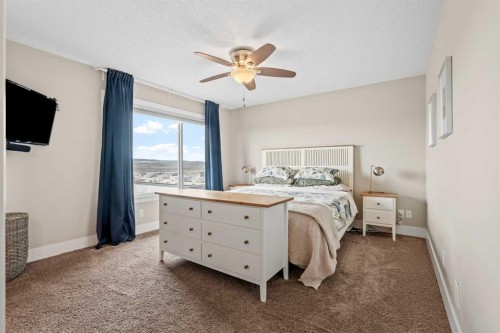 10 Heritage View, Cochrane, AB - Indoor Photo Showing Bedroom