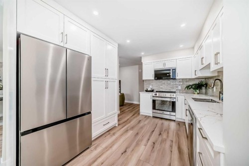 80 Coachway Gardens Sw, Calgary, AB - Indoor Photo Showing Kitchen With Stainless Steel Kitchen With Upgraded Kitchen