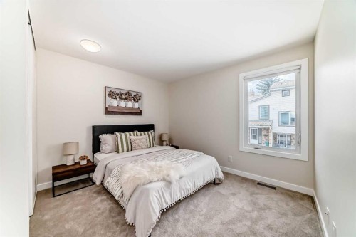 80 Coachway Gardens Sw, Calgary, AB - Indoor Photo Showing Bedroom