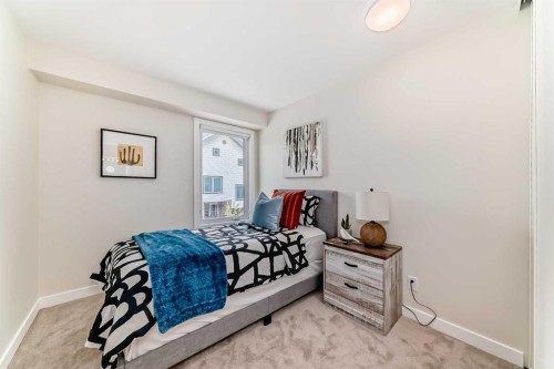 80 Coachway Gardens Sw, Calgary, AB - Indoor Photo Showing Bedroom