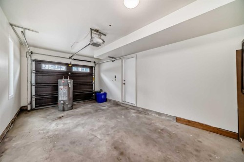 80 Coachway Gardens Sw, Calgary, AB - Indoor Photo Showing Garage