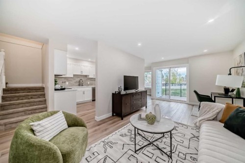80 Coachway Gardens Sw, Calgary, AB - Indoor Photo Showing Living Room