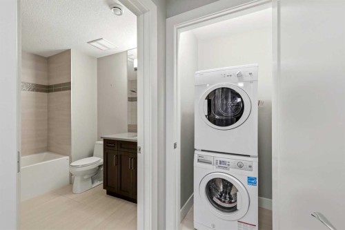 75 Aspen Summit Court Sw, Calgary, AB - Indoor Photo Showing Laundry Room