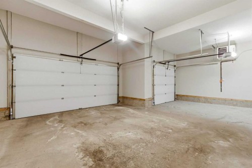 75 Aspen Summit Court Sw, Calgary, AB - Indoor Photo Showing Garage