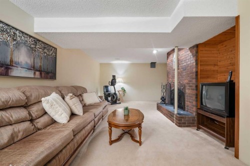 479 Templevale Drive Ne, Calgary, AB - Indoor Photo Showing Living Room With Fireplace