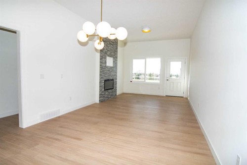 31 Wolf Crescent, Okotoks, AB - Indoor Photo Showing Other Room With Fireplace